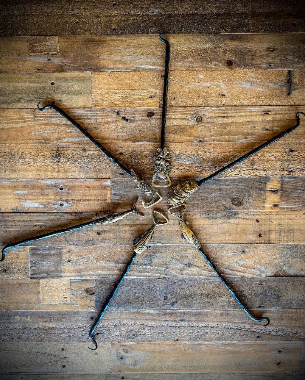 A set of HookNHide steak flippers.